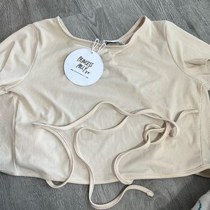 Beige open back princess polly top